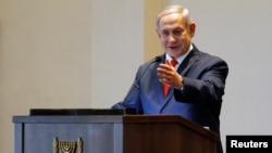 FILE - Israeli Prime Minister Benjamin Netanyahu gestures as he speaks during a news conference at the State House, in Entebbe, Uganda, Feb. 3, 2020.