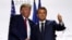 FILE - U.S. President Donald Trump, left, and French President Emmanuel Macron shake hands after their joint press conference at the G-7 summit, in Biarritz, France, Aug. 26, 2019.