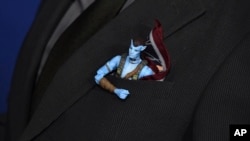 A toy sticks out of the pocket of Todd McFarlane at the US premiere of "Avatar: The Way of Water," Dec. 12, 2022, at Dolby Theatre in Los Angeles.