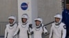 NASA's SpaceX Crew-10 astronauts walk from the Operations & Checkout Building at the Kennedy Space Center, in Cape Canaveral