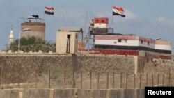 An Egyptian soldier stands guard on the border between Egypt and southern Gaza Strip, Sept. 8, 2013. 