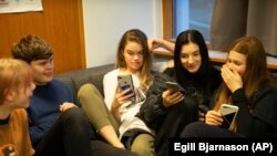 Teenagers in Iceland gather at the Tjornin youth center in Reykjavik. Iceland has changed a teenage culture of drinking and smoking by focusing on local participation in music and sports options for students.