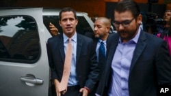 Opposition leader Juan Guaido arrives to the headquarters of the Democratic Action political party in Caracas, Venezuela, Jan. 15, 2020. 