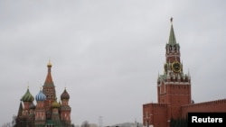 Police officers walk along the Red Square after the city authorities announced a partial lockdown to prevent the spread of coronavirus disease (COVID-19), in central Moscow, Russia, March 30, 2020. 