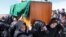 Afghan women's rights activists carry the coffin of 27-year-old Farkhunda, who was beaten to death by a mob, during her funeral in Kabul, March 22, 2015.