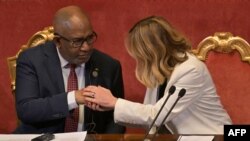 Italy's Prime Minister, Giorgia Meloni, shakes hands with, Azali Assoumani, the President of Comoros and Chairperson of the African Union, during the Italy-Africa international conference 'A bridge for common growth’, Rome, Jan. 29, 2024.