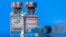 FILE PHOTO: Vials with Pfizer-BioNTech and Moderna coronavirus disease (COVID-19) vaccine