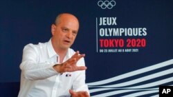 FILE - Jean-Michel Blanquer, French education minister, talks during an interview in Tokyo, July 25, 2021. Blanquer is no fan of a nonbinary pronoun that has been added to an esteemed French dictionary, saying that “inclusive writing is not the future of the French language."