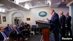 U.S. President Donald Trump takes questions during the coronavirus response daily briefing at the White House in Washington, March 19, 2020.