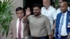 Marxist lawmaker Anura Kumara Dissanayake waves as he departs the election commission office after winning the presidential election in Colombo, Sri Lanka, Sept. 22, 2024. 