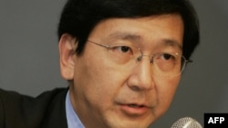 FILE - Professor Johannes M. Chan addresses the media during a press conference