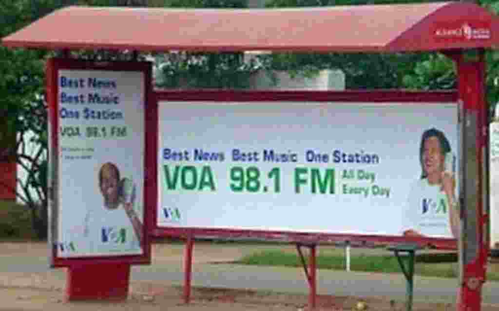 Bus shelter sign in Accra, Ghana.