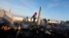 Palestinians inspect the site of an Israeli strike on a beachfront cafe, amid the ongoing conflict between Israel and Hamas, in Deir Al-Balah in the central Gaza Strip, Jan. 14, 2025.