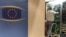 Communication technicians work at a phone and internet cable closet, at the European Council building in Brussels, July 1, 2013. 