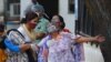 A woman mourns after seeing the body of her son who died due to COVID-19, outside a mortuary of a COVID-19 hospital in New Delhi, India, May 12, 2021.