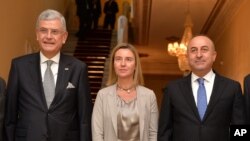 From left, Turkey's European Union Affairs Minister Volkan Bozkir, EU Foreign Affairs and Security Policy Vice President of the Commission Federica Mogherini and Turkish Foreign Minister Mevlut Cavusoglu in Ankara, Dec. 8, 2014.