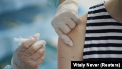  A new recruit of Russia's Baltic Fleet receives a dose of the Sputnik V vaccine against COVID-19 at a recruiting station in Kaliningrad, Russia on May 27, 2021.