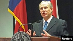 Texas Attorney General Greg Abbott speaks at a news conference in Austin, Texas, about a lawsuit challenging the president's use of an executive order to ease the threat of deportation for some undocumented immigrants, Dec. 3, 2014. 