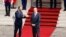 Former French Prime Minister Edouard Philippe applauds newly appointed Prime Minister Jean Castex in the courtyard of the Matignon Hotel during the handover ceremony in Paris, France, July 3, 2020. 