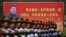 资料照:解放军士兵列队在中国领导人习近平画像前走过。(2015年8月22日)