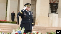 U.S Joint Chiefs of Staff chairman Gen. Mark Milley salutes during a ceremony to mark the 79th anniversary of the assault that led to the liberation of France and Western Europe from Nazi control, at the American Cemetery in Colleville-sur-Mer, Normandy, France, Tuesday, June 6, 2023. The American Cemetery is home to the graves of 9,386 United States soldiers. Most of them lost their lives in the D-Day landings and ensuing operations. (AP Photo/Thomas Padilla)