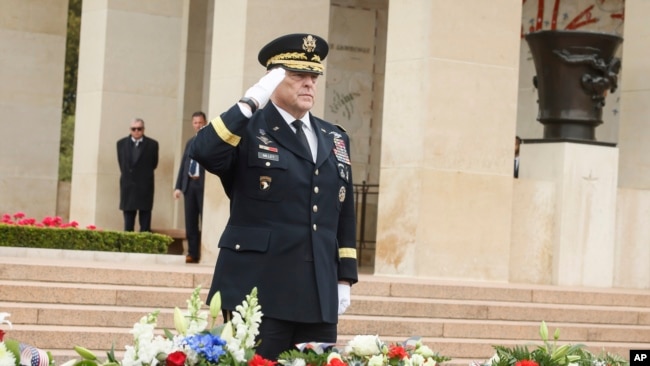 U.S Joint Chiefs of Staff chairman Gen. Mark Milley salutes during a ceremony to mark the 79th anniversary of the assault that led to the liberation of France and Western Europe from Nazi control, at the American Cemetery in Colleville-sur-Mer, Normandy, France, Tuesday, June 6, 2023. The American Cemetery is home to the graves of 9,386 United States soldiers. Most of them lost their lives in the D-Day landings and ensuing operations. (AP Photo/Thomas Padilla)