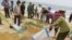 FILE- In this April 28, 2016, file photo, villagers bury dead fish on a beach in Quang Binh, Vietnam. Toxic waste discharged from a Taiwanese-owned Formosa Plastics Group steel complex unit in central Vietnam harmed the livelihoods of more than 200,000 people, including 41,000 fishermen, the Vietnamese government said on Friday in tallying the damage from what it has called the country’s worst environmental disaster according to local media. The company has pledged to pay $500 million in compensation.