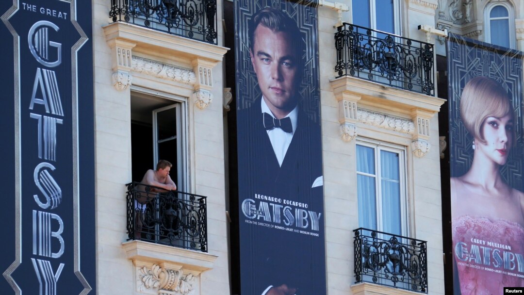 Posters for the film 'The Great Gatsby' showing actor Leonardo DiCaprio (C) and actress Carey Mulligan (R) are displayed outside the Carlton Hotel before the start of the 66th Cannes Film Festival in Cannes, May 13, 2013.