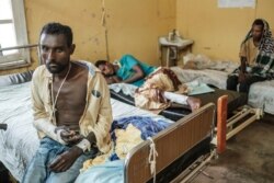 Survivors of the Mai-Kadra massacre, recover at the Gondar University Hospital, in the city of Gondar, Ethiopia, Nov. 20, 2020.