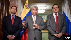 Venezuelan Ambassador to Russia Carlos Rafael Faria Tortosa (from left), Venezuela's minister of agriculture Wilmar Castro Soteldo and finance minister Simon Zerpa give a press briefing in Moscow after Venezuela signed a debt restructuring deal with Russia on Nov.15, 2017.