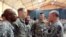 General Martin Dempsey, right, chairman of the Joint Chiefs of Staff, speaks to U.S. troops at Baghdad International Airport in Iraq, Nov. 15, 2014. 