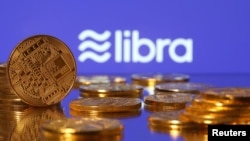 FILE - Representations of Facebook's virtual currency "Libra" are displayed in an illustration picture, June 21, 2019.