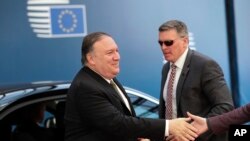 U.S. Secretary of State Mike Pompeo, left, arrives for a meeting with European foreign ministers at the Europa building in Brussels, May 13, 2019.