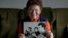 Solveig Leo, 81, former head of a large state-owned farm in the East when Germany was divided, shows a photo of herself from her youth, in the northeastern village of Banzkow, Germany, on Oct. 28, 2024.