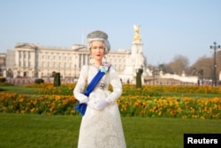 Undated handout photo of the Queen Elizabeth II Barbie doll to mark the British monarch's Platinum Jubilee. Courtesy Mattel