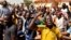 FILE - Civil organizations hold a protest following an attack on a gendarmerie post that killed 32 people, calling for Burkina Faso's President Roch Marc Kabore to resign and for departure of French forces that patrol the country, in Ouagadougou, Burkina Faso, Nov. 16, 2021.