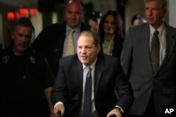 Harvey Weinstein arrives at a Manhattan courthouse for jury deliberations in his rape trial, in New York, Feb. 24, 2020.