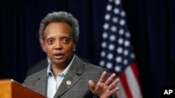 Chicago mayor Lori Lightfoot responds to a question after Illinois Gov. J.B. Pritzker announced a shelter in place order to combat the spread of the Covid-19 virus, during a news conference, March 20, 2020, in Chicago. 