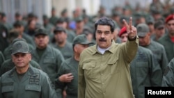 Venezuela's President Nicolas Maduro gestures during a meeting with soldiers at a military base in Caracas, Venezuela January 30, 2019. Miraflores Palace/Handout via REUTERS ATTENTION EDITORS - THIS PICTURE WAS PROVIDED BY A THIRD PARTY. TPX IMAGES O