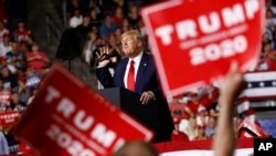 In this Aug. 15, 2019 photo, President Donald Trump speaks at a campaign rally in Manchester, N.H. 