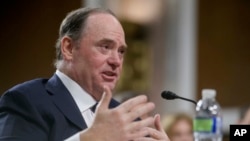 John Phelan, President Donald Trump's nominee to be Navy secretary, appears before the Senate Armed Services Committee on Capitol Hill, Feb. 27, 2025, in Washington.