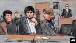 FILE - In this March 5, 2015 courtroom sketch, Dzhokhar Tsarnaev, center, is depicted between defense attorneys Miriam Conrad, left, and Judy Clarke, right, during his federal death penalty trial in Boston. 