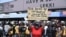 A demonstrator holds a placard to protest against abuses by the Special Anti-Robbery Squad (SARS) at the Lekki toll plaza in Lagos, Nigeria, Oct. 12, 2020.