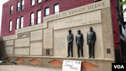 A sign at the Clayton Jackson McGhie Memorial in Duluth, Minnesota, reads 'Justice for George Floyd,' June 9, 2020. (M. Young/VOA)