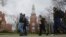 Brooklyn College students walk between classes on campus in New York.