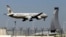 FILE - An Etihad Airways plane prepares to land at the Abu Dhabi airport in the United Arab Emirates, May 4, 2014.