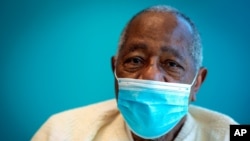 FILE - Baseball Hall of Famer Hank Aaron sits for a portrait on Jan. 5, 2021,after receiving his COVID-19 vaccination at the Morehouse School of Medicine in Atlanta. He died at the age of 86. 