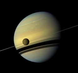 Titan in front of Saturn as seen by Cassini. (Image credit: NASA)