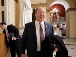 FILE - Ted Yoho, a Republican congressman from Florida, smiles following a TV interview on Capitol Hill in Washington, March 23, 2017.