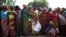 FILE - Women stand in line for food aid in the village of Makunzi Wali, Central African Republic.